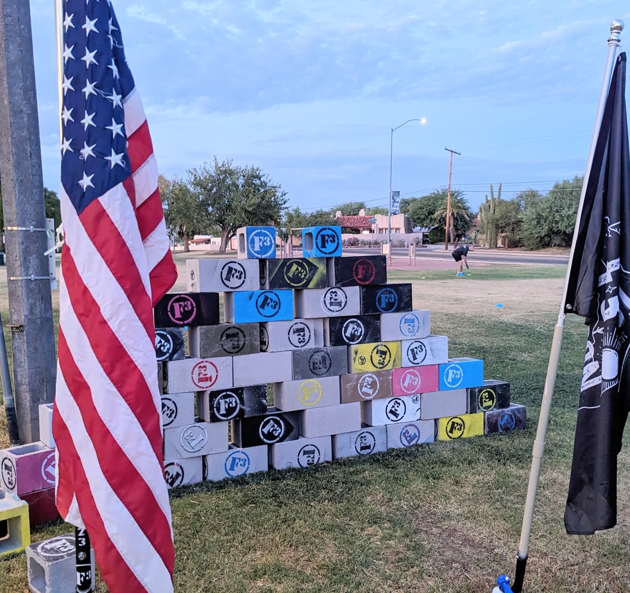 F3 men doing a wall exercise in a workout