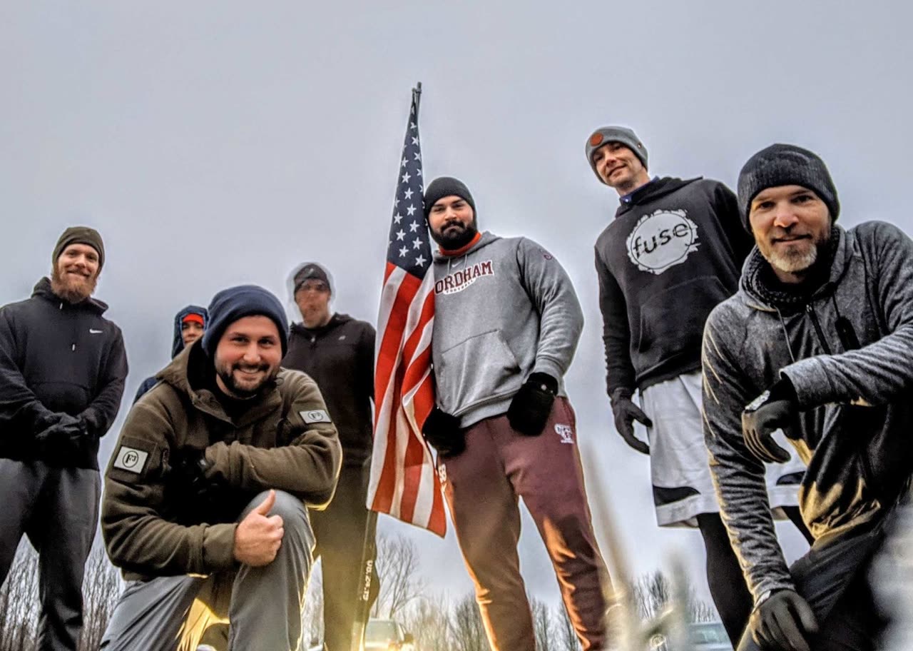 F3 men working out together before dawn